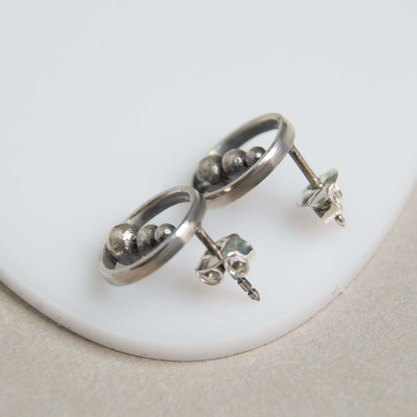 Round Frame Earrings With Silver Beads